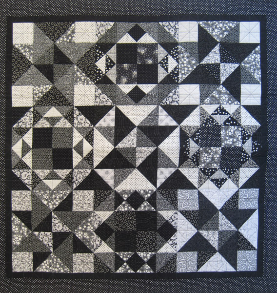 Quilt detail with bold triangles